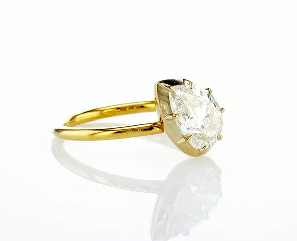 Sideway pear diamond button ring